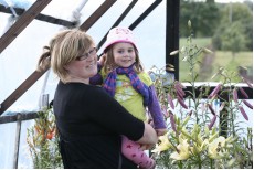 Gyte Ciplijauskiene - wife of Jonas Ciplijauskas with daughter Vakare enjoy blooming lilies....